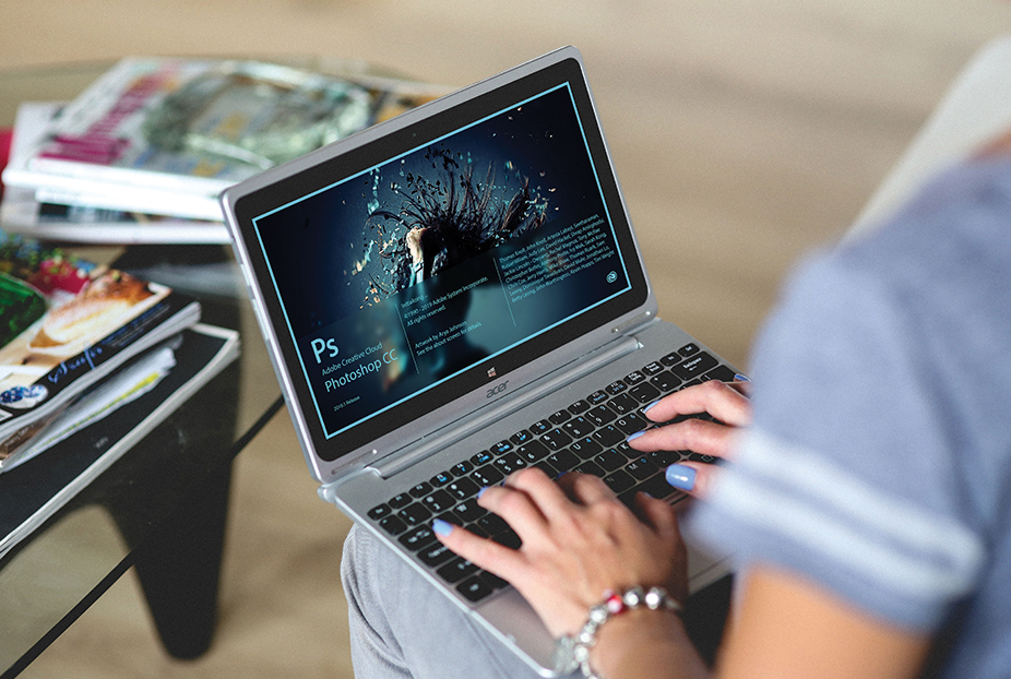 Decorative photo: Photoshop start screen on a woman's laptop computer.