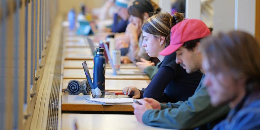 A row of students studying in Norlin library