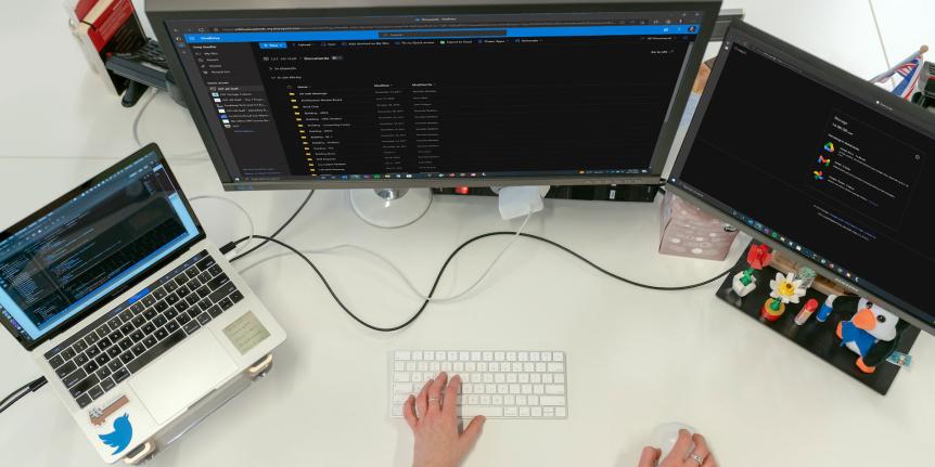 Computer screens displaying Microsoft OneDrive and Google Storage.