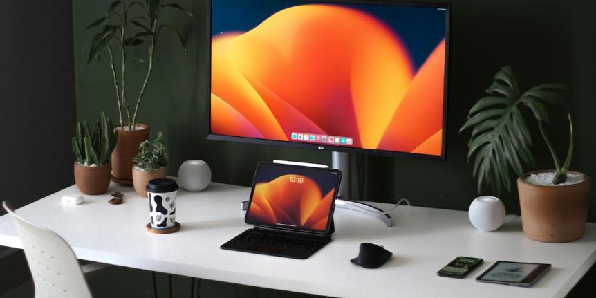 Photo of desk with mac computer 