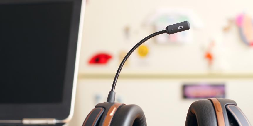 Photo of workstation with headset and computer