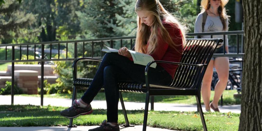 Someone studying outside on the CU Boulder campus