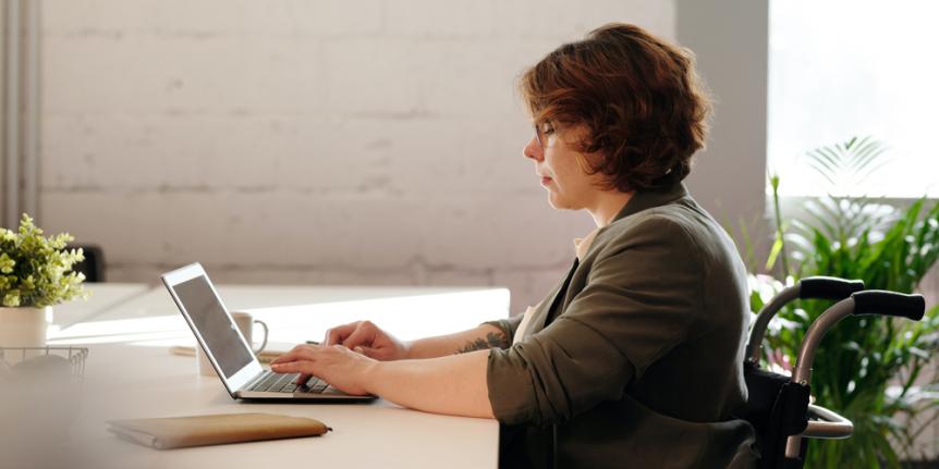 Woman typing on laptop